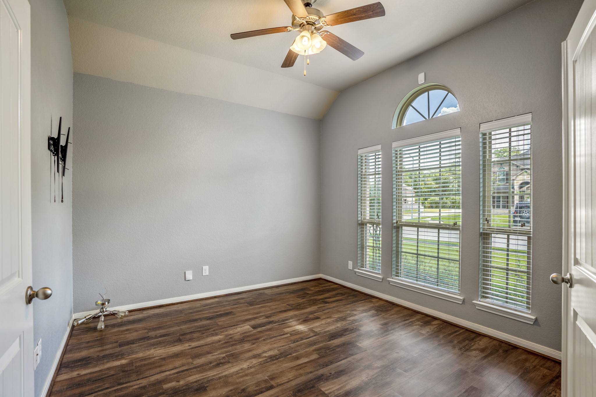 5319 Claymore Meadow Lane Spring, TX 77389 - Photo 5 of 34 wooden floor in an empty room with a window