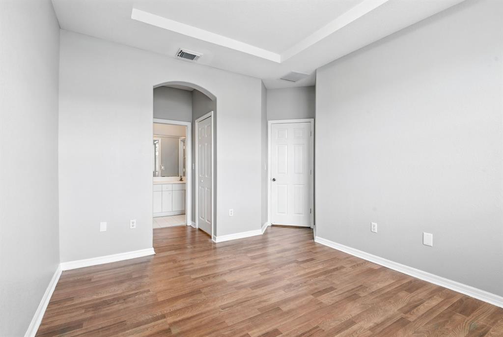 24055 Southwest 109th Court Homestead, FL 33032 - Photo 20 of 42 an empty room with wooden floor and closet