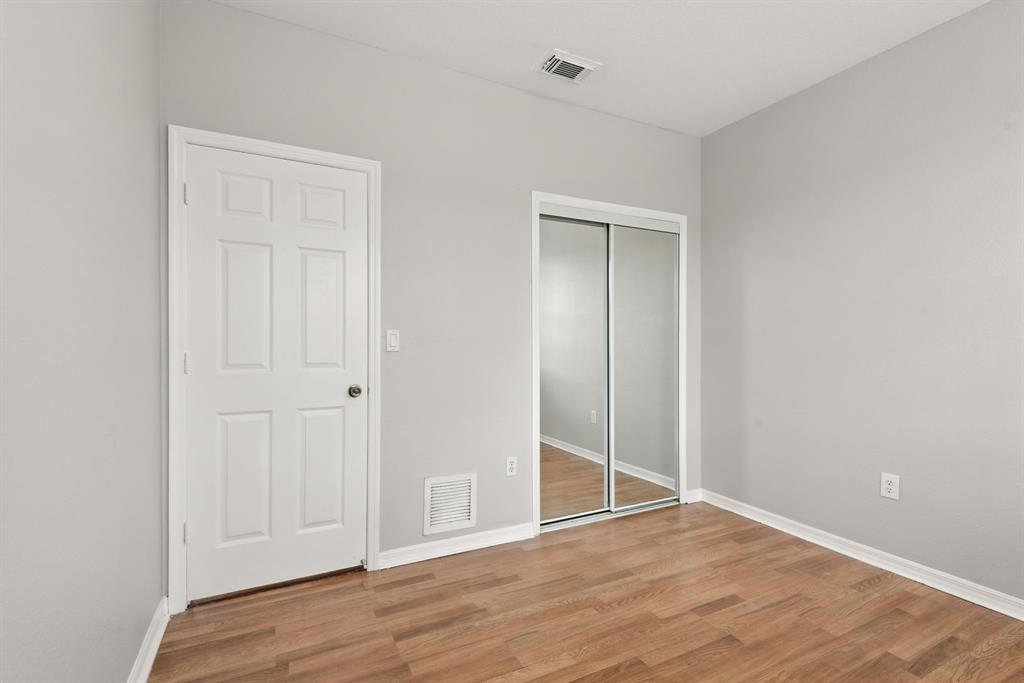 24055 Southwest 109th Court Homestead, FL 33032 - Photo 30 of 42 a view of an empty room with wooden floor