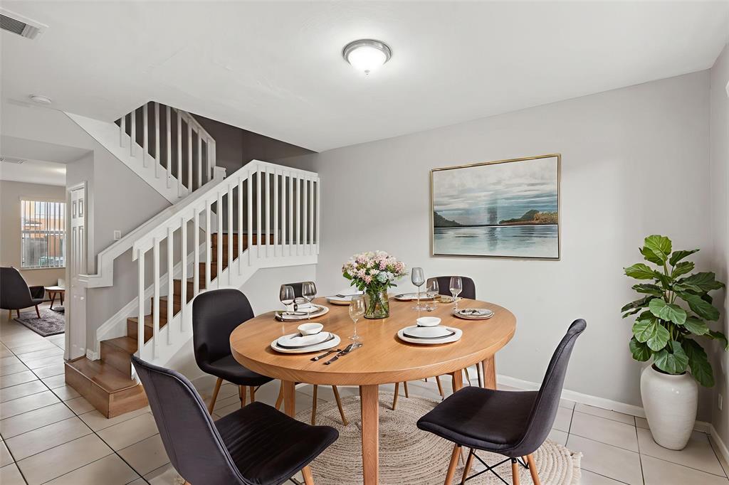 24055 Southwest 109th Court Homestead, FL 33032 - Photo 3 of 42 a view of a dining room with furniture and wooden floor