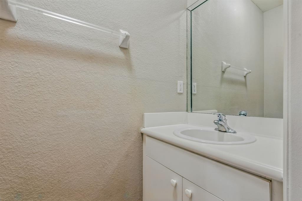 24055 Southwest 109th Court Homestead, FL 33032 - Photo 32 of 42 a bathroom with a sink and a mirror