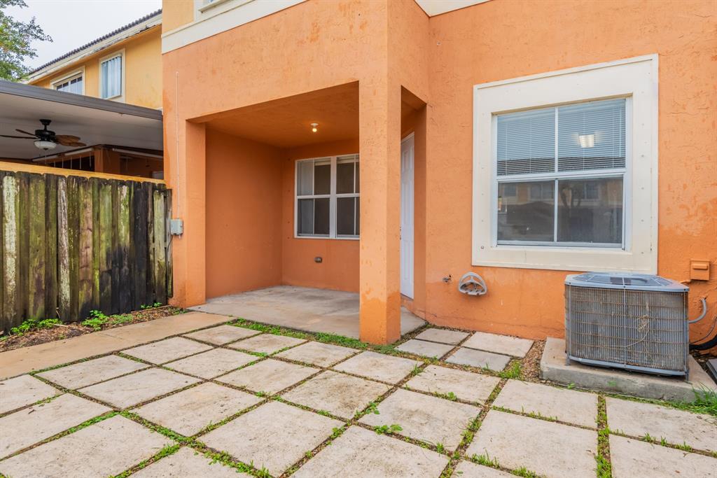24055 Southwest 109th Court Homestead, FL 33032 - Photo 33 of 42 a backyard of a house with seating space