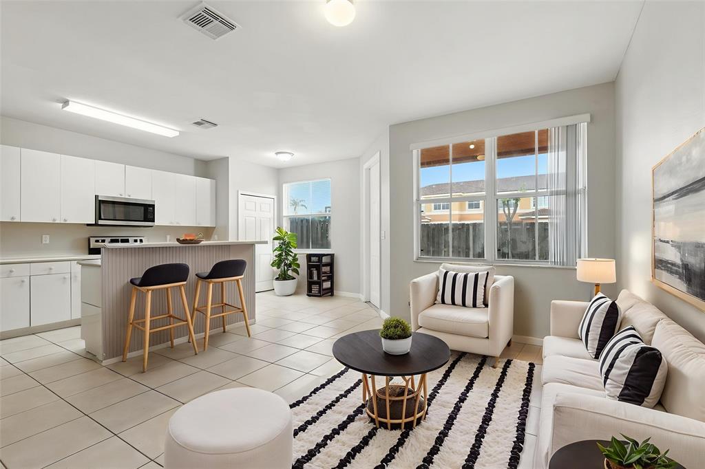 24055 Southwest 109th Court Homestead, FL 33032 - Photo 4 of 42 a living room with furniture and a large window