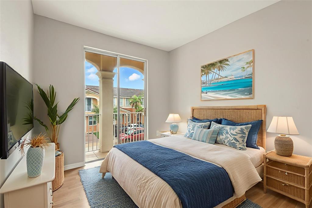 24055 Southwest 109th Court Homestead, FL 33032 - Photo 6 of 42 a bedroom with a bed and a large window