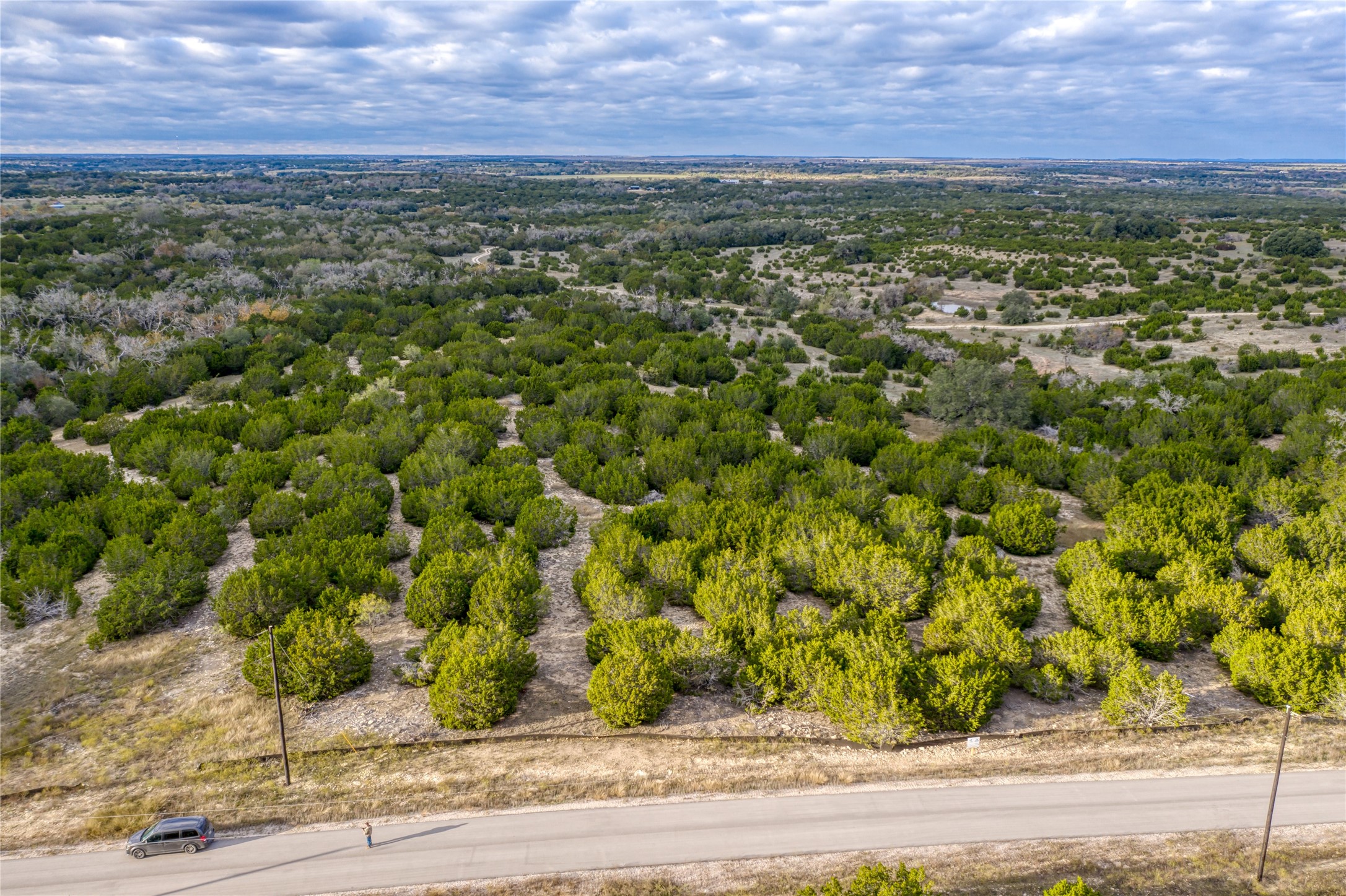 179 Whispering Wind Road Bertram, TX 78605 - Photo 14 of 16 a view of a yard with an outdoor space