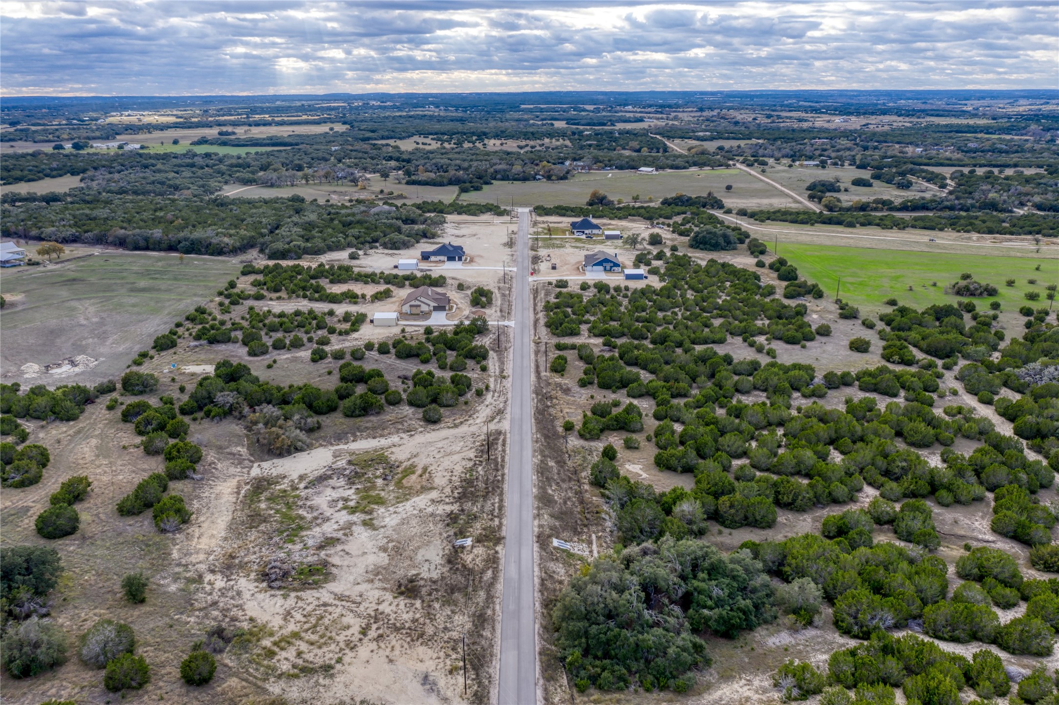 179 Whispering Wind Road Bertram, TX 78605 - Photo 5 of 16 a view of a city with ocean view