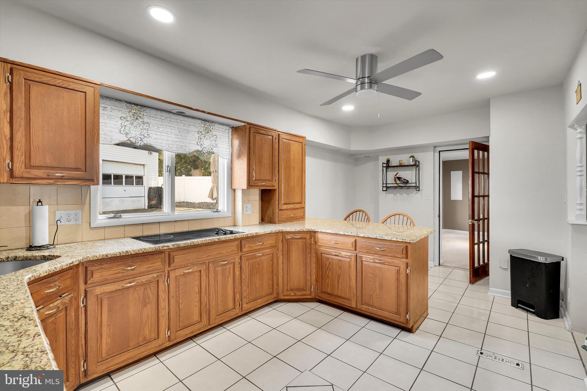13497 Trevose Road Philadelphia, PA 19116 - Photo 11 of 34 a large kitchen with stainless steel appliances granite countertop a stove sink and cabinets