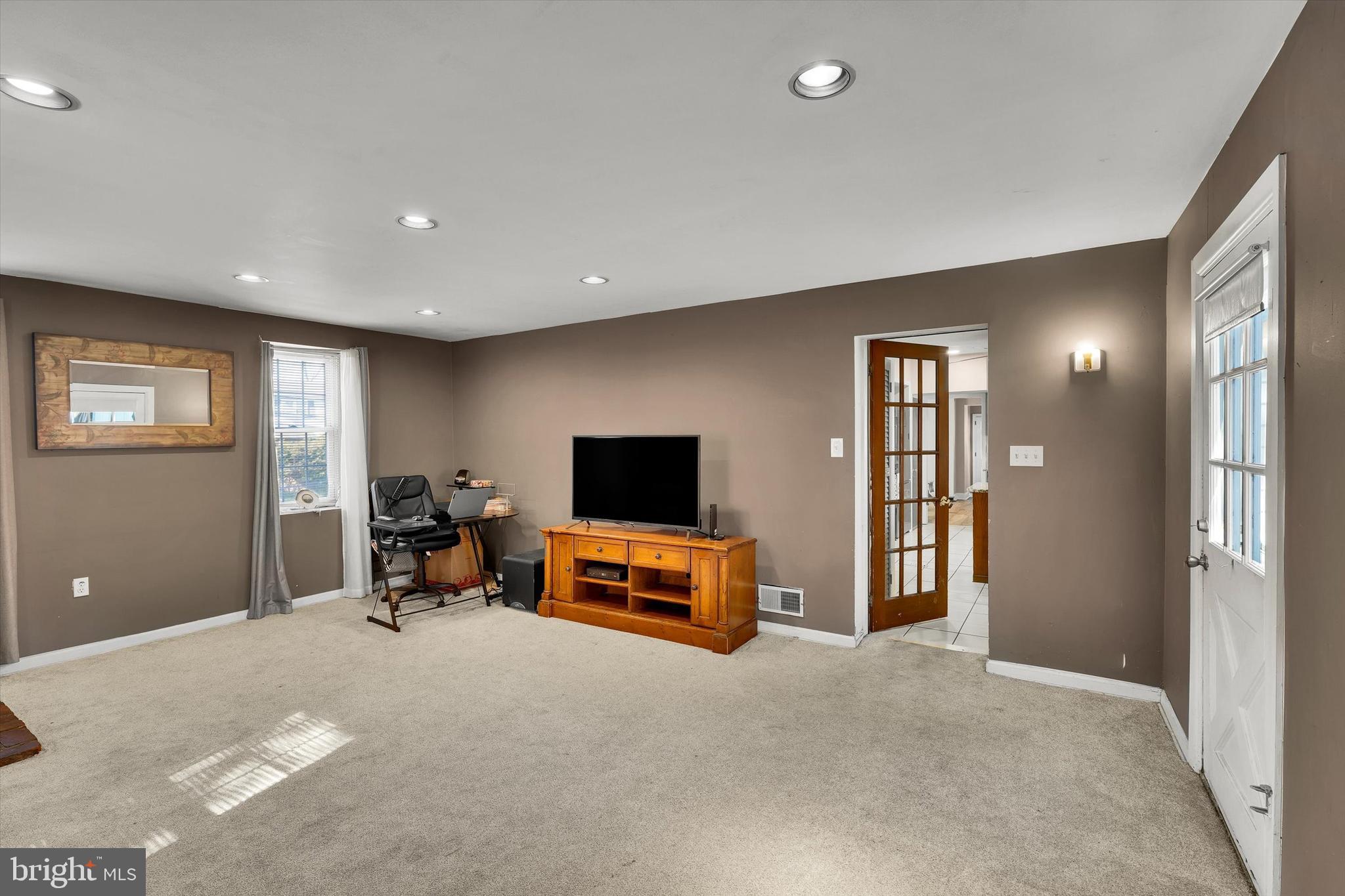 13497 Trevose Road Philadelphia, PA 19116 - Photo 19 of 34 a living room with furniture and a flat screen tv