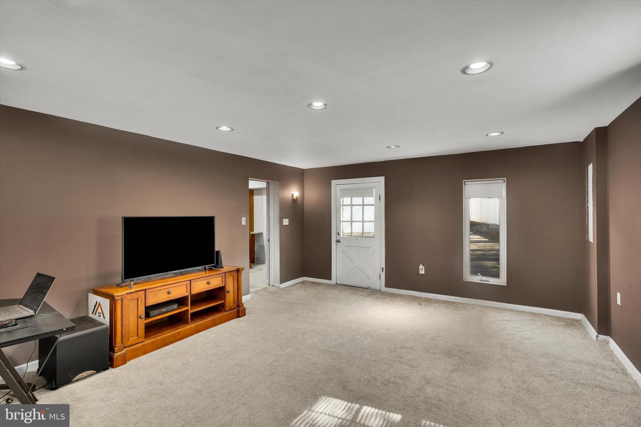 13497 Trevose Road Philadelphia, PA 19116 - Photo 20 of 34 a living room with furniture and a flat screen tv