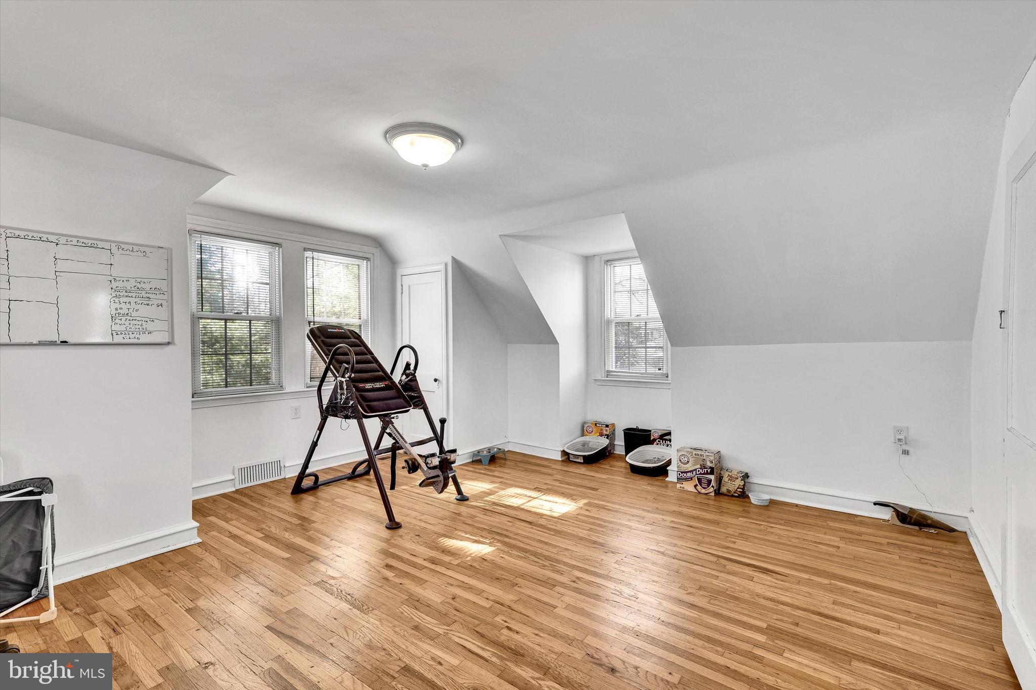 13497 Trevose Road Philadelphia, PA 19116 - Photo 27 of 34 a view of a room with gym equipment and a wooden floor
