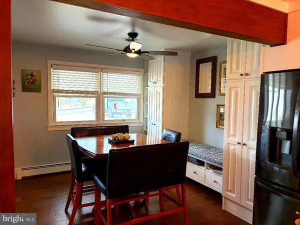 a dining room with furniture and window