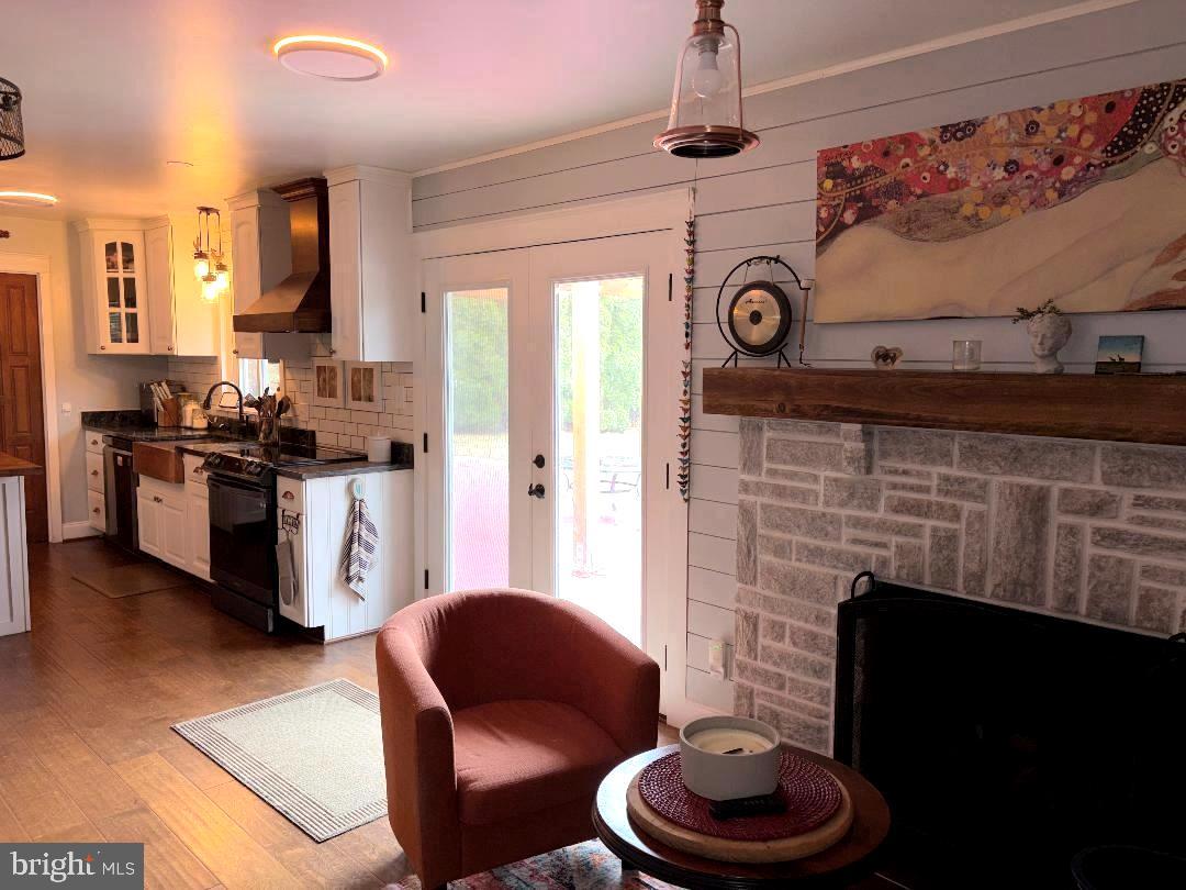 2615 Whitt Road Kingsville, MD 21087 - Photo 34 of 45 a kitchen with a stove and a fireplace