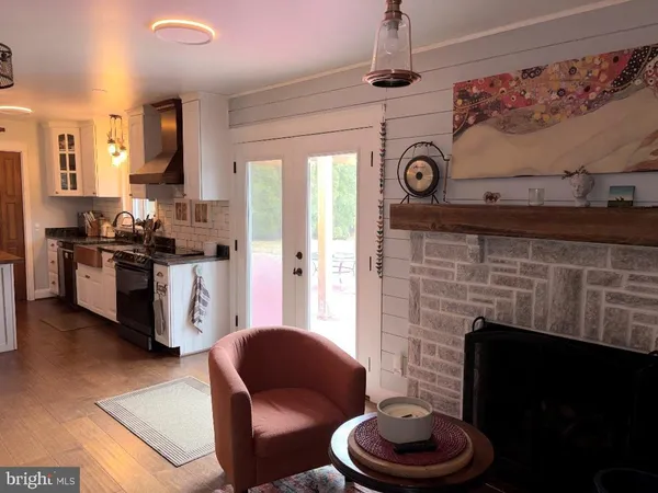 a kitchen with a stove and a fireplace