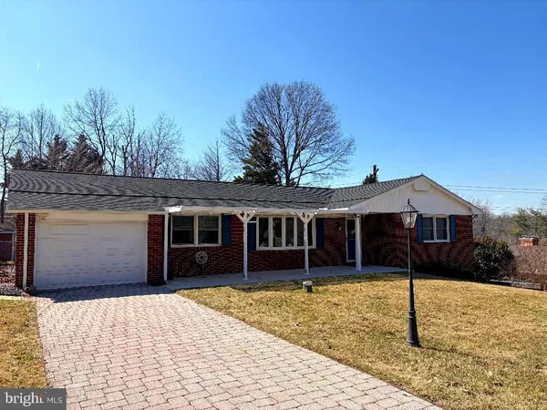 a house with trees in the background