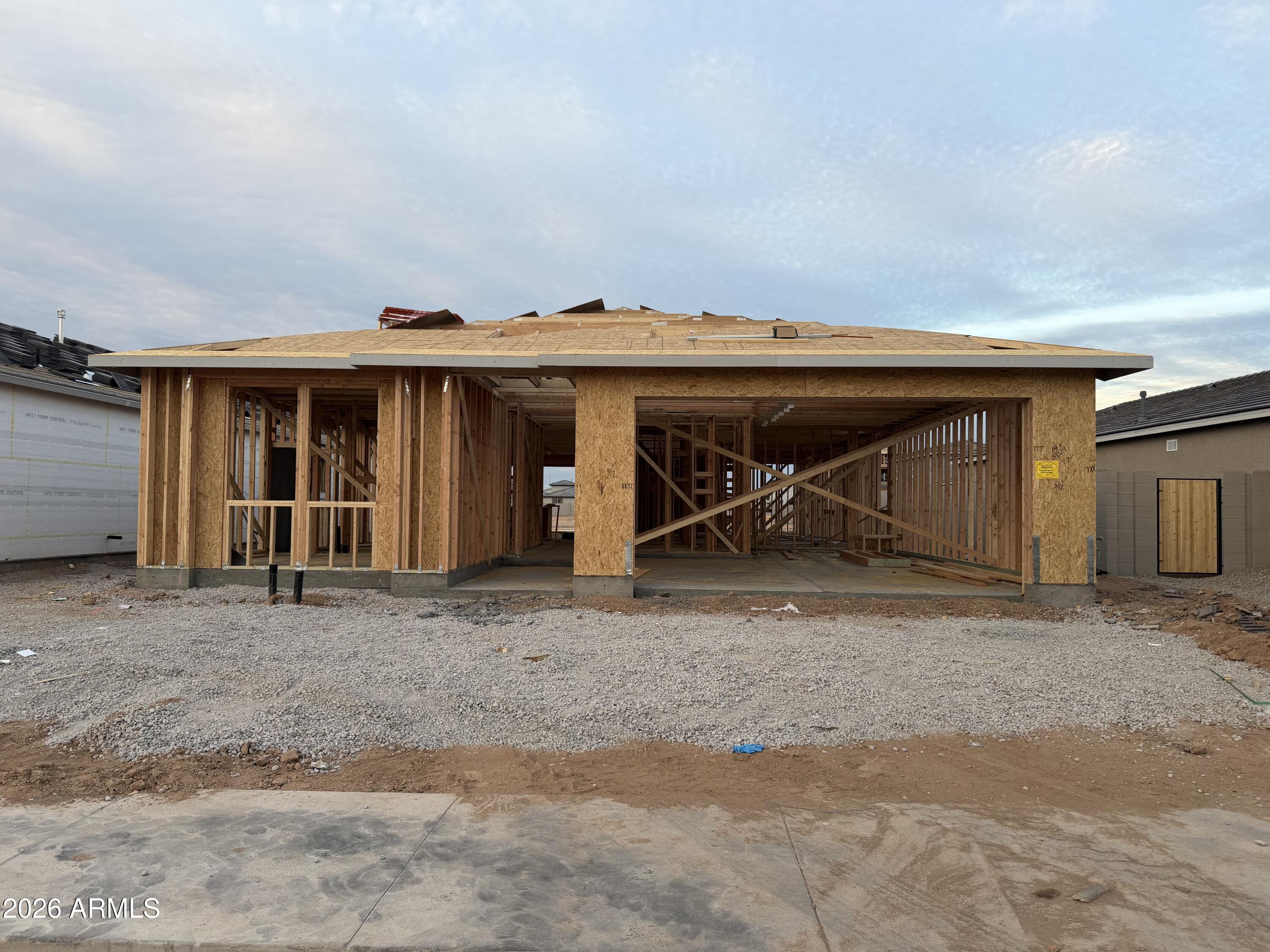 5606 West Piedmont Road Laveen, AZ 85339 - Photo 2 of 19 a front view of a house with a garage