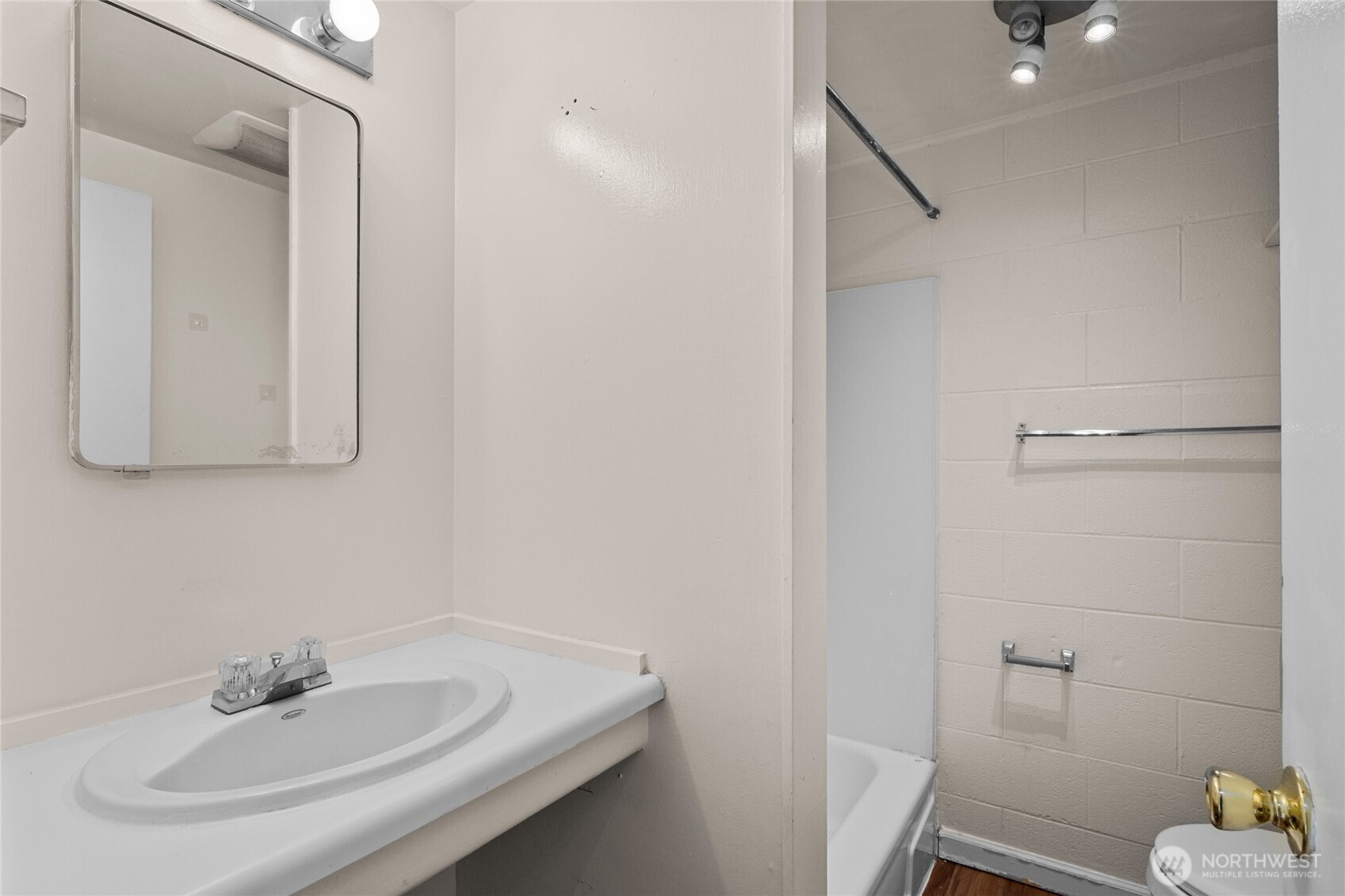 801 Northwest 54th Street Seattle, WA 98107 - Photo 15 of 25 a bathroom with a sink and a mirror