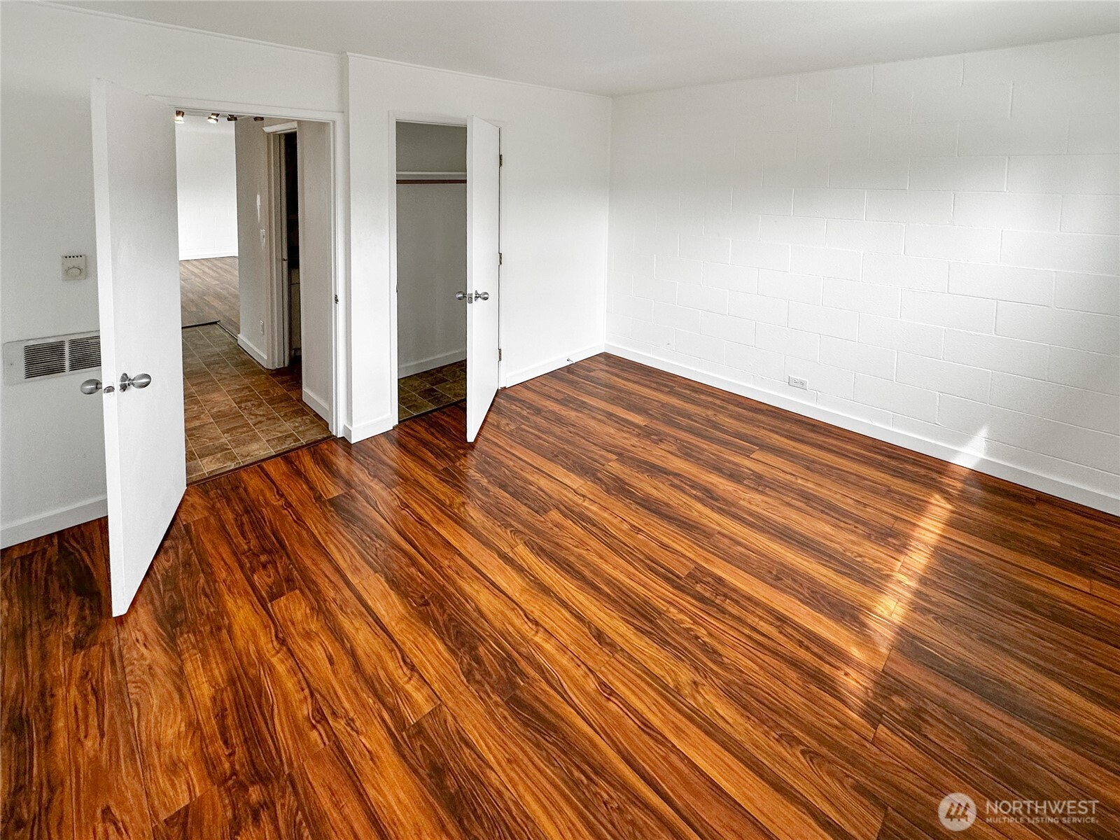 801 Northwest 54th Street Seattle, WA 98107 - Photo 8 of 25 a bedroom with a bed and painting on the wall