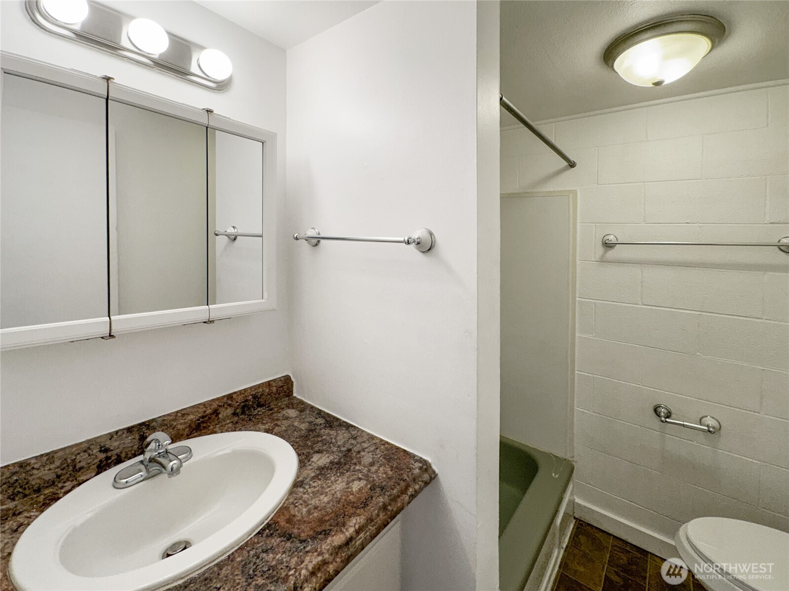 801 Northwest 54th Street Seattle, WA 98107 - Photo 9 of 25 a bathroom with a sink and mirror