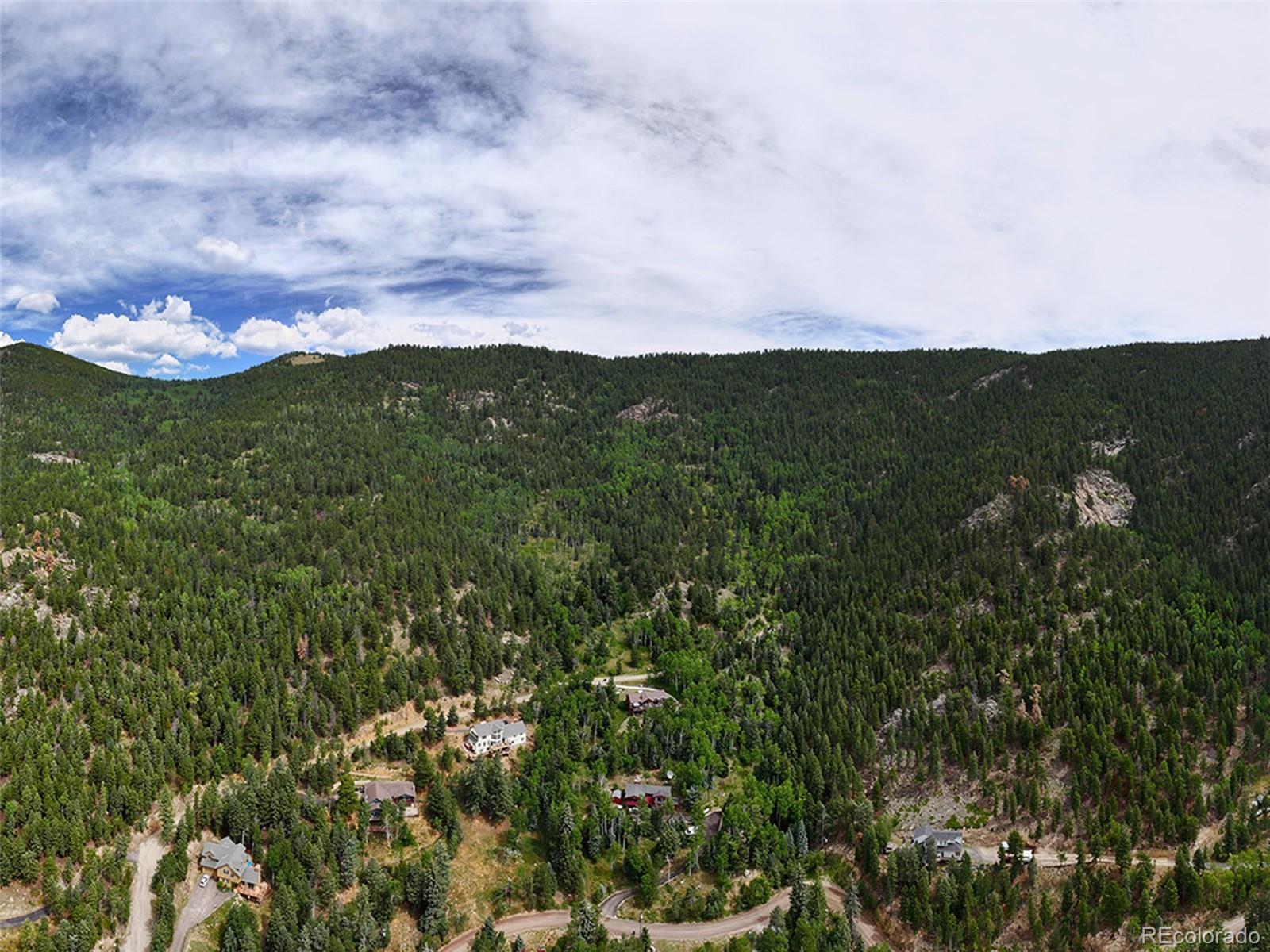0 Snyder Mountain Road Evergreen, CO 80439 - Photo 13 of 46 an aerial view of houses covered in trees
