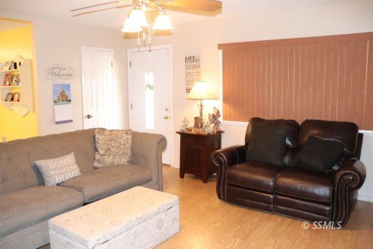 1624 South Farragut Street Ridgecrest, CA 93555 - Photo 6 of 43 a living room with furniture and a large window