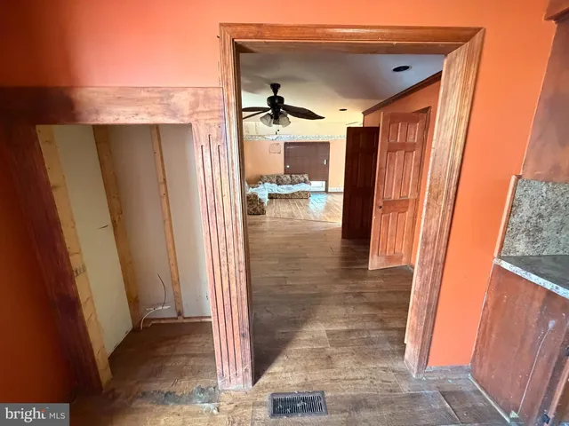 a view of living room with a fireplace furniture and a large window