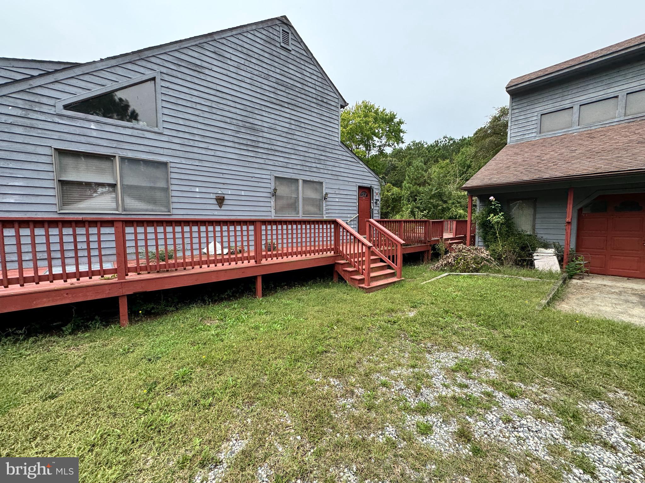 23540 Deal Island Road Chance, MD 21821 - Photo 2 of 41 a front view of a house with garden
