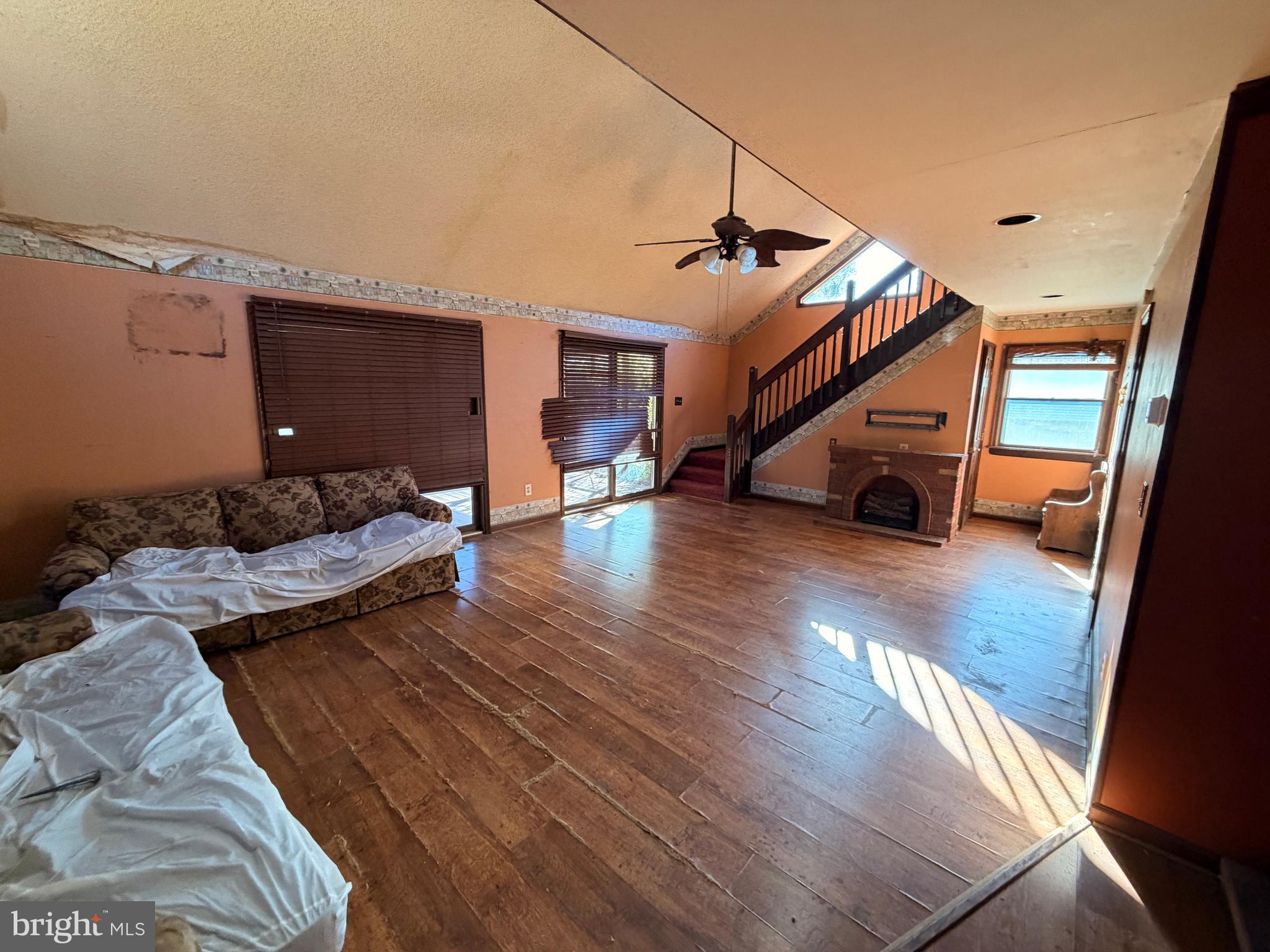 23540 Deal Island Road Chance, MD 21821 - Photo 23 of 41 a living room with furniture and a wooden floor