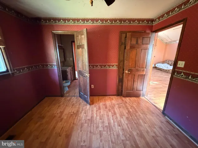 a view of balcony with furniture and wooden floor