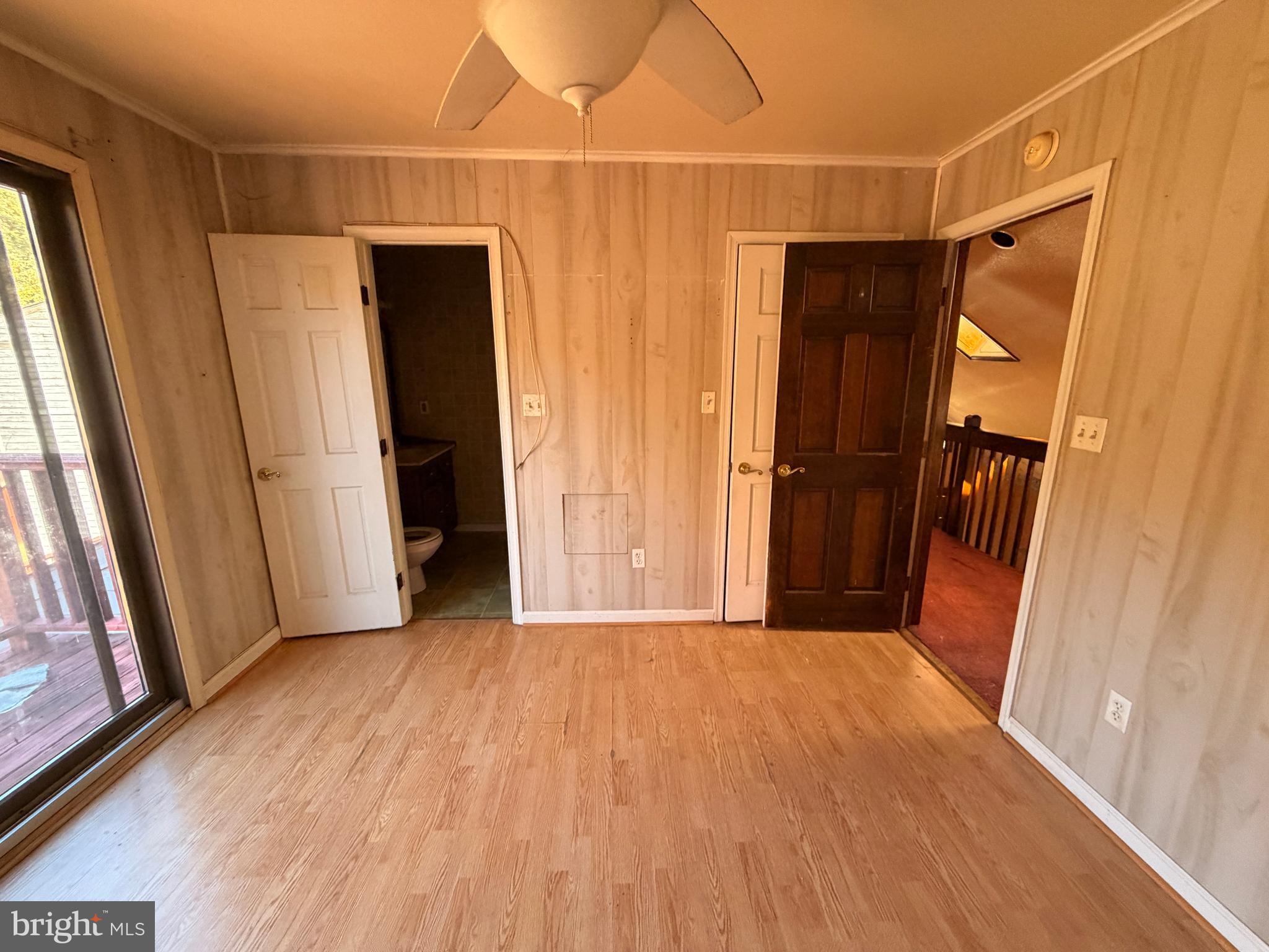 23540 Deal Island Road Chance, MD 21821 - Photo 37 of 41 a view of empty room with wooden floor and fan