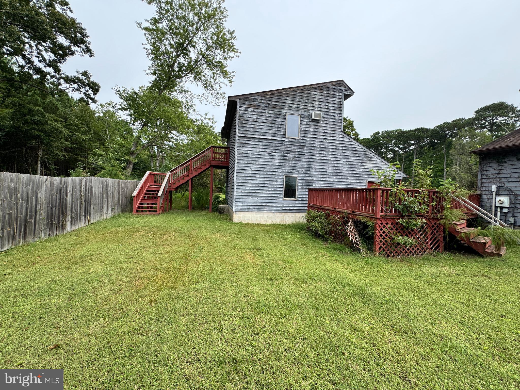 23540 Deal Island Road Chance, MD 21821 - Photo 4 of 41 a view of a backyard with a sitting area and slide