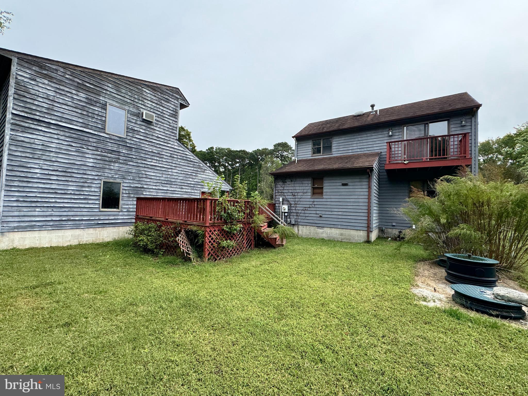 23540 Deal Island Road Chance, MD 21821 - Photo 5 of 41 a view of a backyard with plants and a barbeque