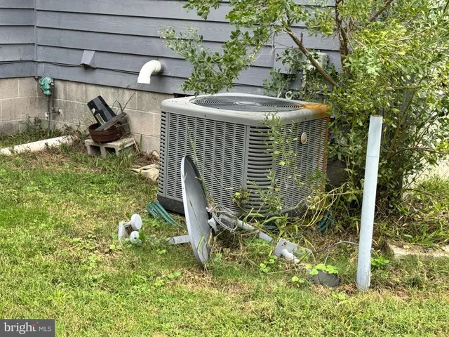a view of a chair and table in backyard