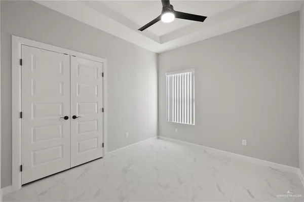 a view of an empty room and window