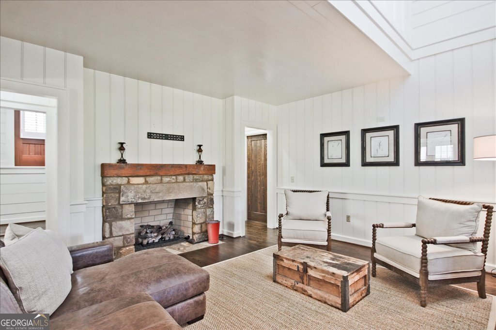 109 Coneflower Lane Toccoa, GA 30577 - Photo 11 of 49 a living room with furniture a fireplace and a table