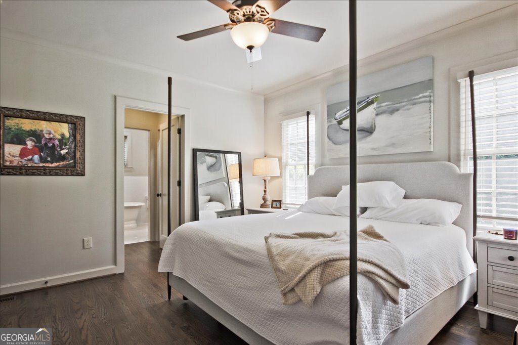 109 Coneflower Lane Toccoa, GA 30577 - Photo 17 of 49 a bedroom with a large bed and a chandelier