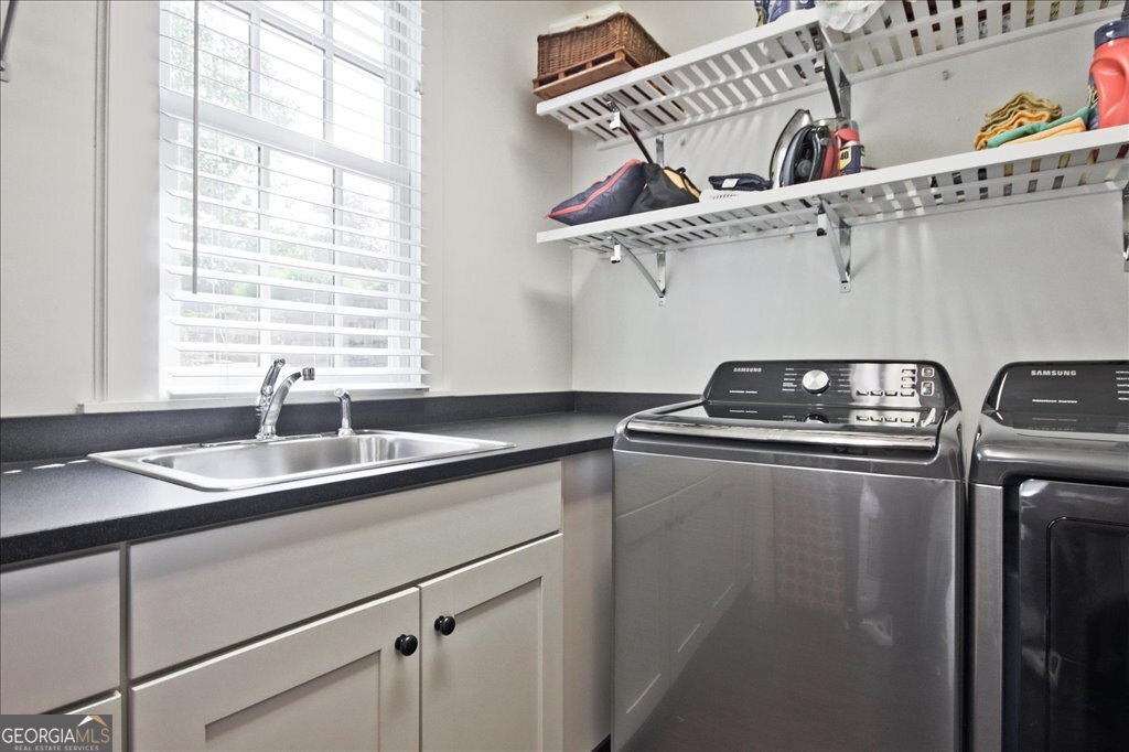 109 Coneflower Lane Toccoa, GA 30577 - Photo 23 of 49 a kitchen with stainless steel appliances a sink and a window