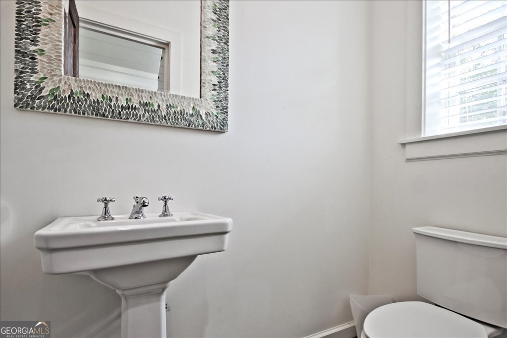 109 Coneflower Lane Toccoa, GA 30577 - Photo 24 of 49 a bathroom with a sink mirror and toilet