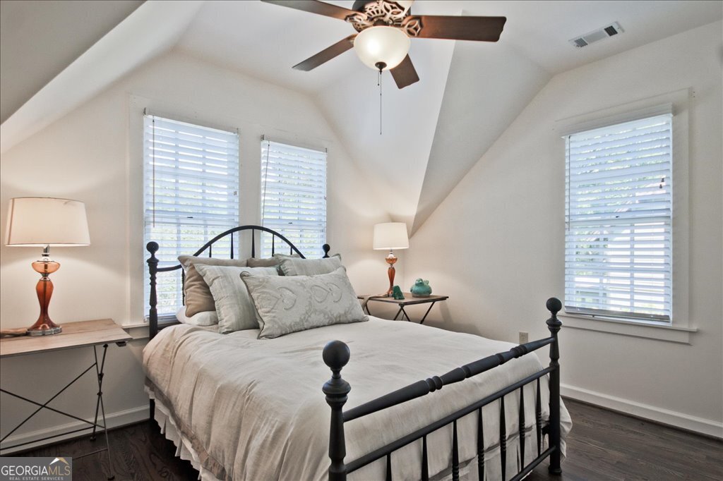 109 Coneflower Lane Toccoa, GA 30577 - Photo 26 of 49 a bedroom with a bed and a chandelier