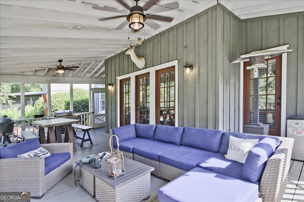 109 Coneflower Lane Toccoa, GA 30577 - Photo 34 of 49 a living room with furniture ceiling fan and a large window