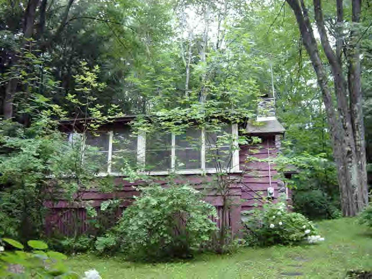 14 Mahkeenac Heights Road Stockbridge, MA 01262 - Photo 2 of 4 a backyard of a house with lots of green space