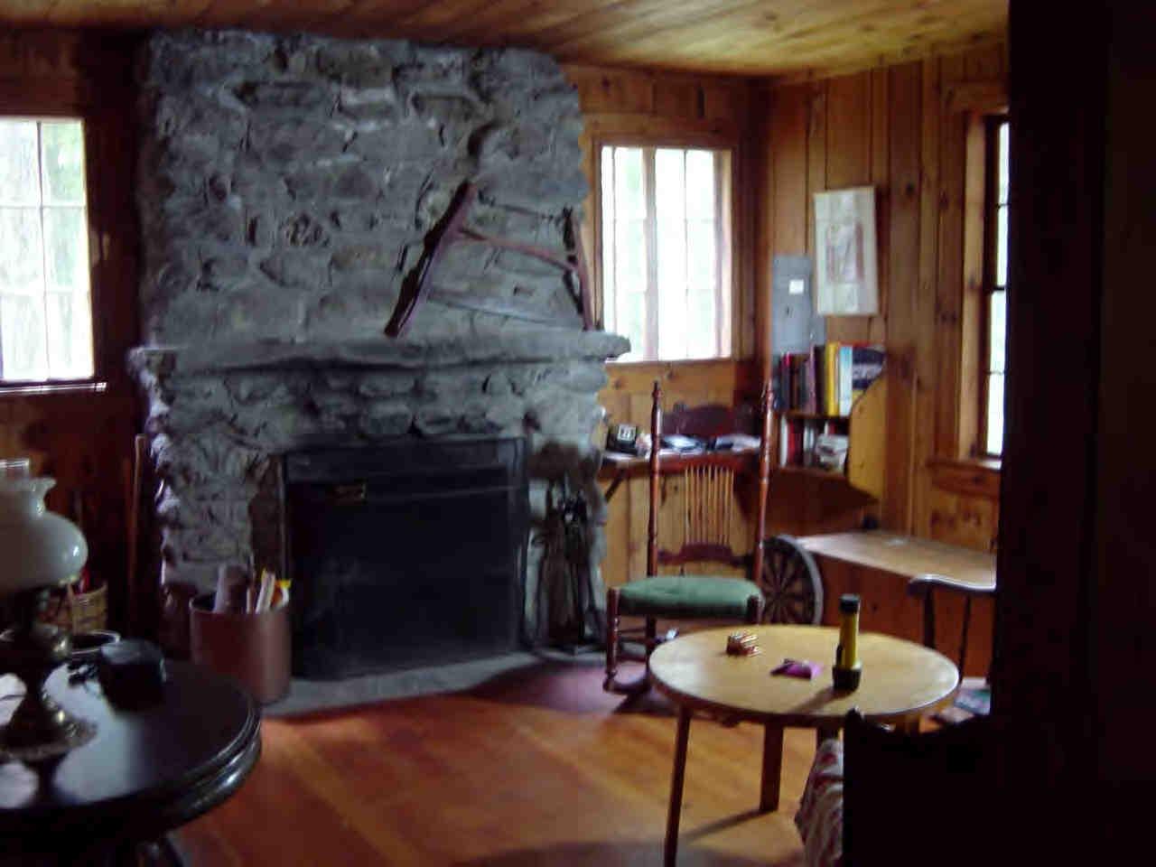 14 Mahkeenac Heights Road Stockbridge, MA 01262 - Photo 3 of 4 a room with furniture and a fireplace