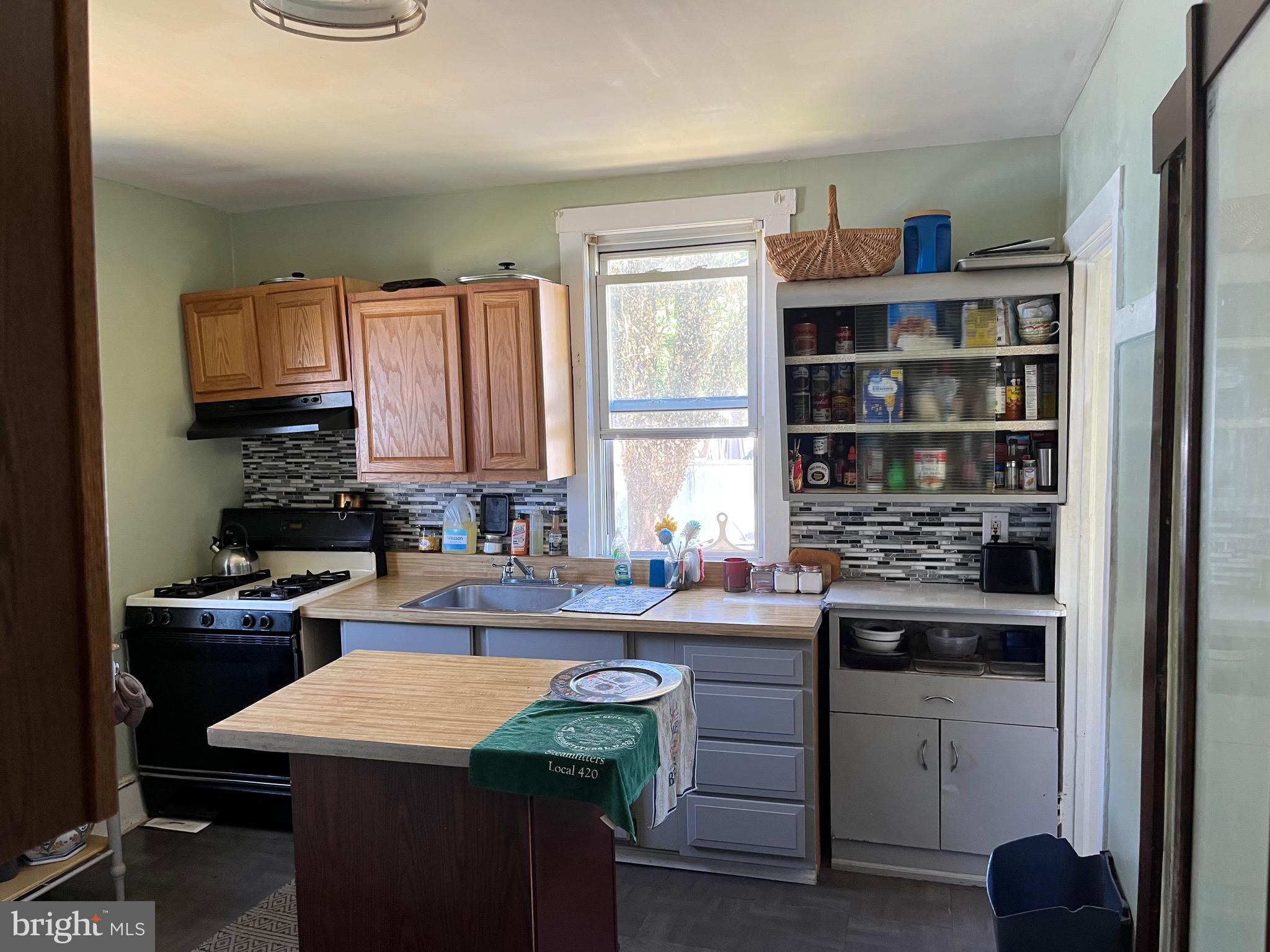 505 Nicholson Road Gloucester City, NJ 08030 - Photo 4 of 10 a kitchen with a sink stove and cabinets
