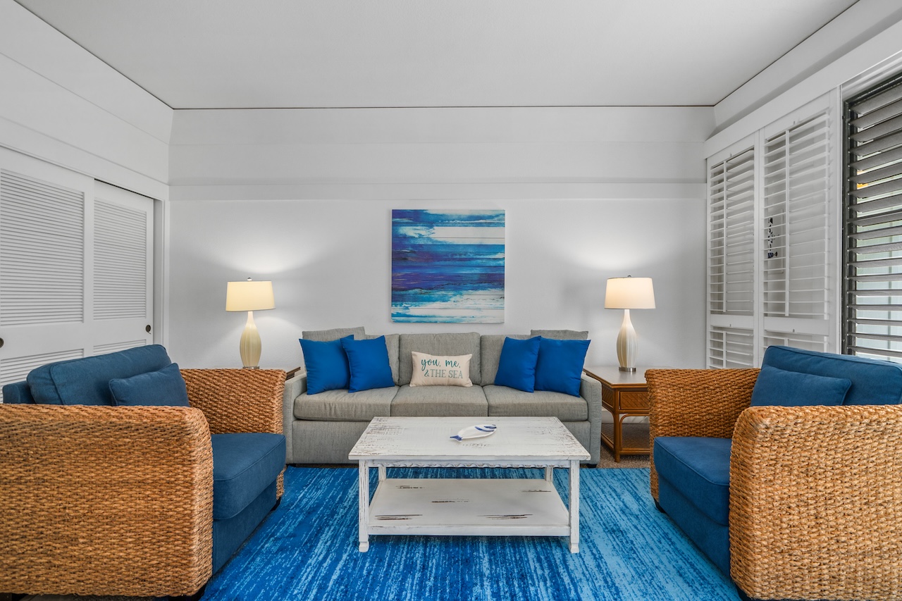 a living room with furniture and a lamp