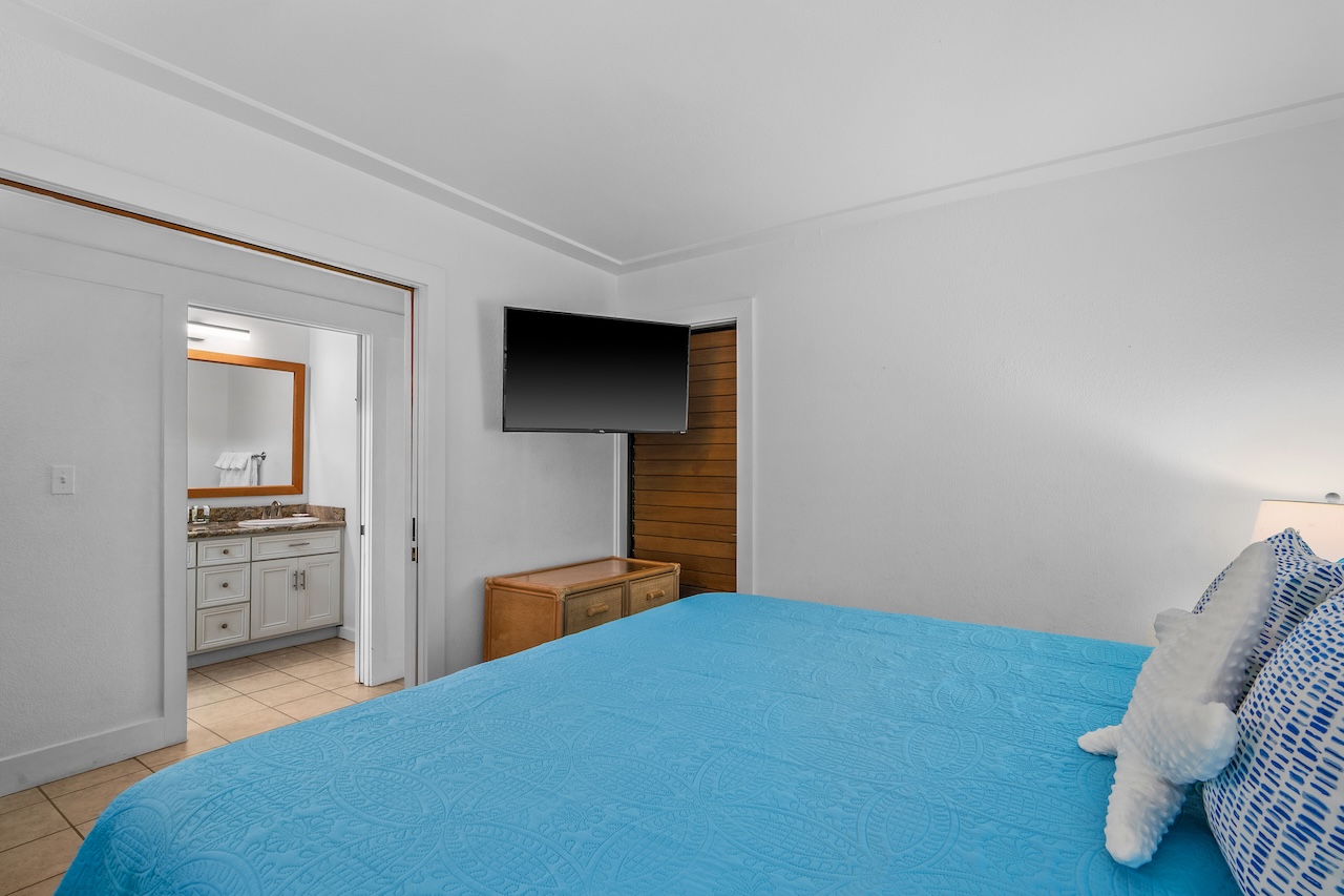 2253 Poipu Road, Unit 440 Koloa, HI 96756 - Photo 14 of 24 a bedroom with a bed and a view of kitchen