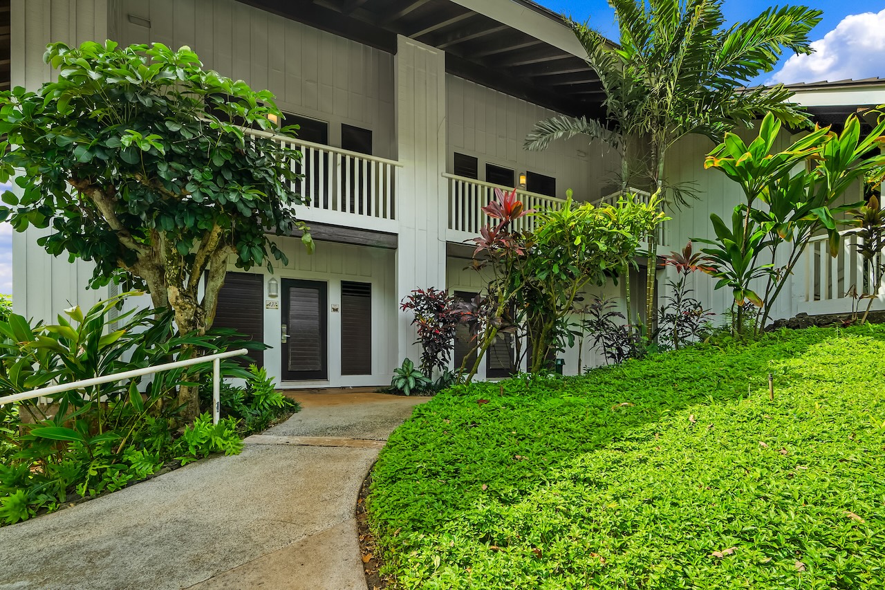 2253 Poipu Road, Unit 440 Koloa, HI 96756 - Photo 19 of 24 a view of a house with a yard and plants