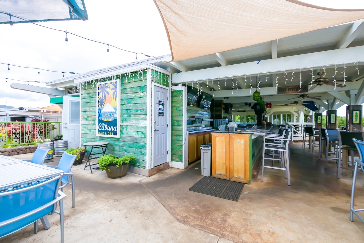 2253 Poipu Road, Unit 440 Koloa, HI 96756 - Photo 23 of 24 a view of a patio with dining table and chairs