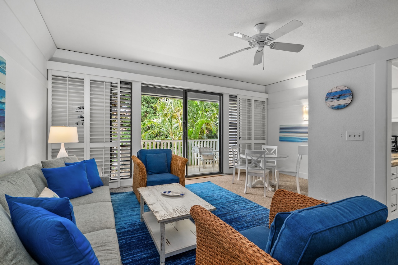 2253 Poipu Road, Unit 440 Koloa, HI 96756 - Photo 3 of 24 a living room with furniture and a large window