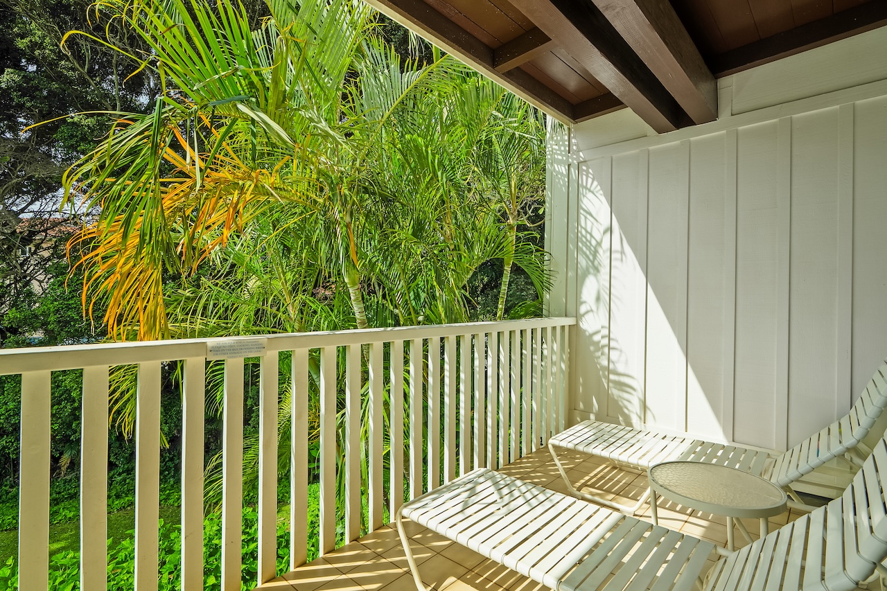 2253 Poipu Road, Unit 440 Koloa, HI 96756 - Photo 5 of 24 a balcony with wooden floor table and chairs