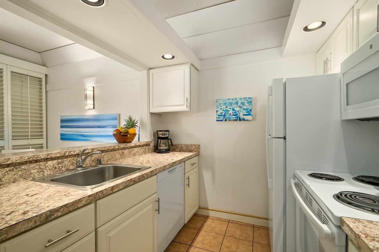 2253 Poipu Road, Unit 440 Koloa, HI 96756 - Photo 10 of 24 a kitchen with a sink and cabinets