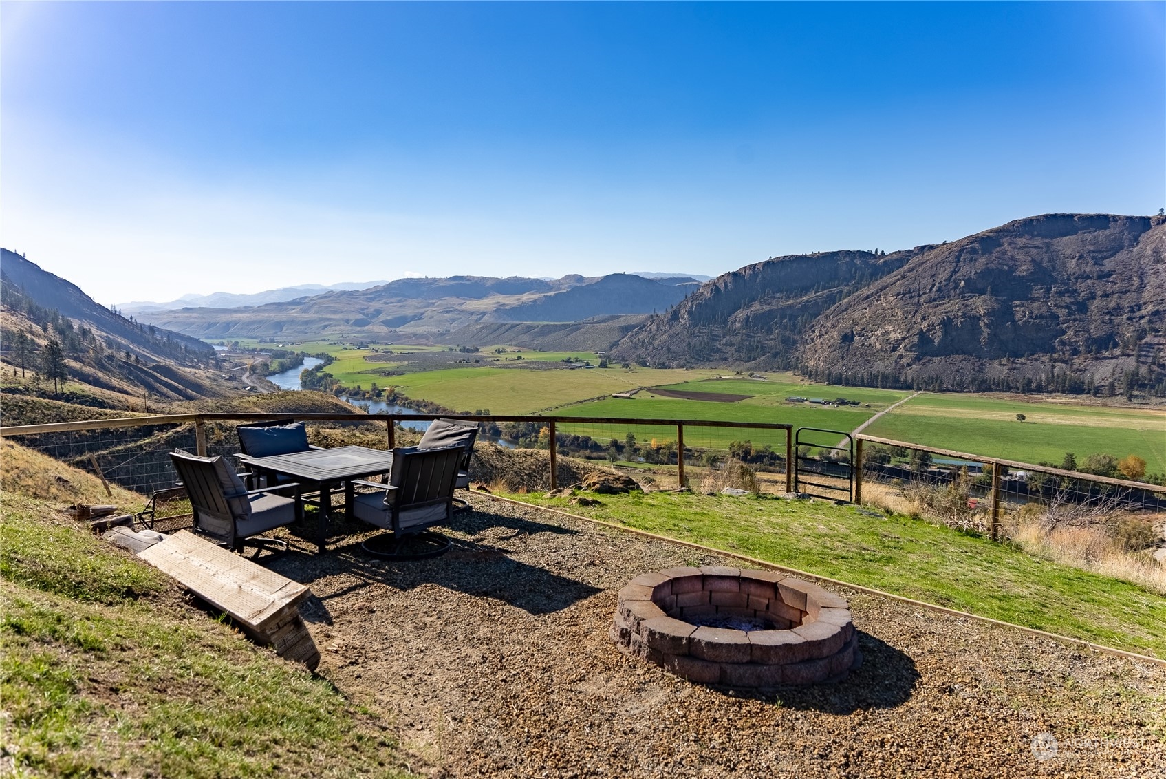 369 Tunk Creek Road Riverside, WA 98849 - Photo 15 of 40 a view of a swimming pool with a table and a chairs